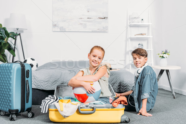 kids packing clothes for trip Stock photo © LightFieldStudios