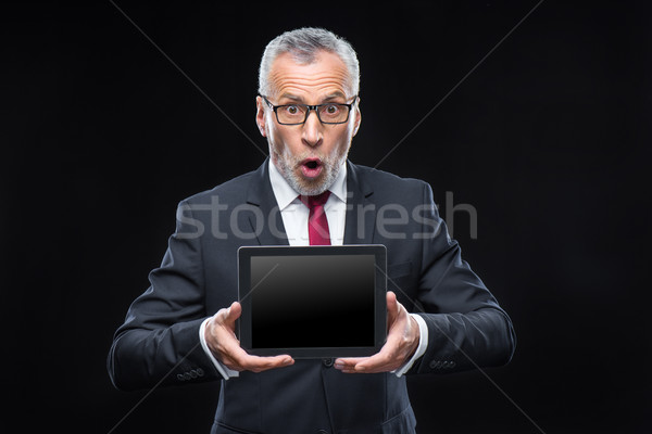 Businessman holding digital tablet Stock photo © LightFieldStudios
