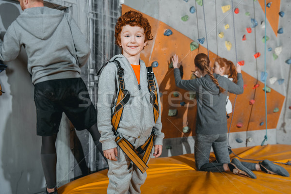 boy in climbing harness at gym Stock photo © LightFieldStudios
