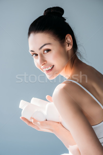 Mosolygó nő tart kozmetikai fiatal nem smink Stock fotó © LightFieldStudios