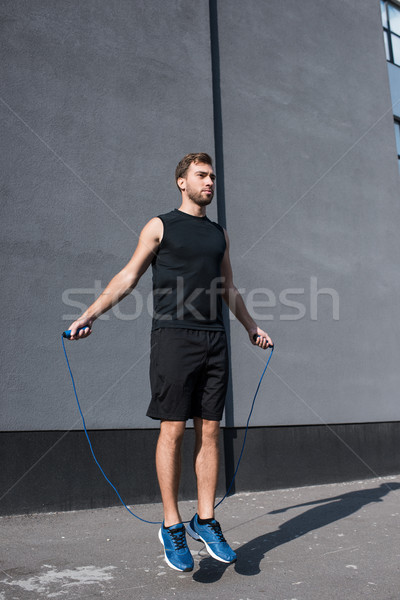 Sportlich Sportler springen Seil jungen Sportbekleidung Stock foto © LightFieldStudios