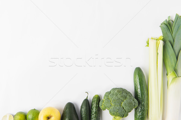 Composition of green vegetables in a row isolated on white background Stock photo © LightFieldStudios