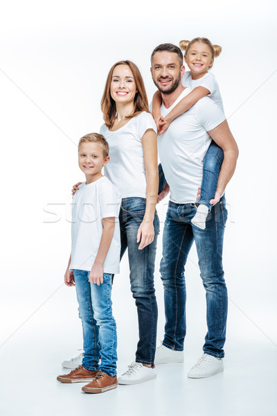 Happy family standing together Stock photo © LightFieldStudios
