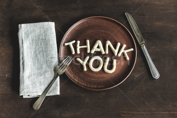 top view of thank you lettering made from cookie dough on wooden plate Stock photo © LightFieldStudios