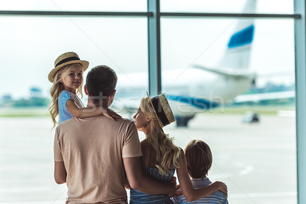 family looking out window in airport Stock photo © LightFieldStudios