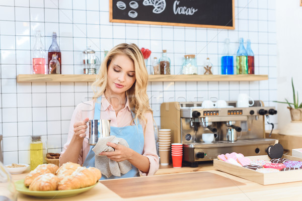 waitress holding jug with milk Stock photo © LightFieldStudios