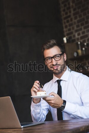 businessman eating cake at cafe Stock photo © LightFieldStudios