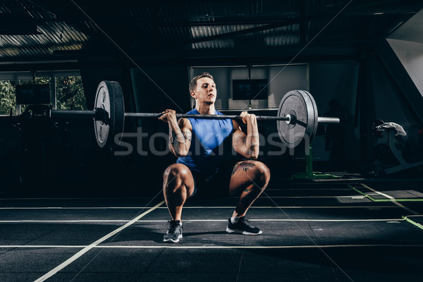 sportsman lifting barbell  Stock photo © LightFieldStudios