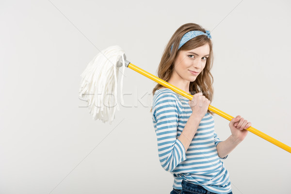 Young woman with mop Stock photo © LightFieldStudios