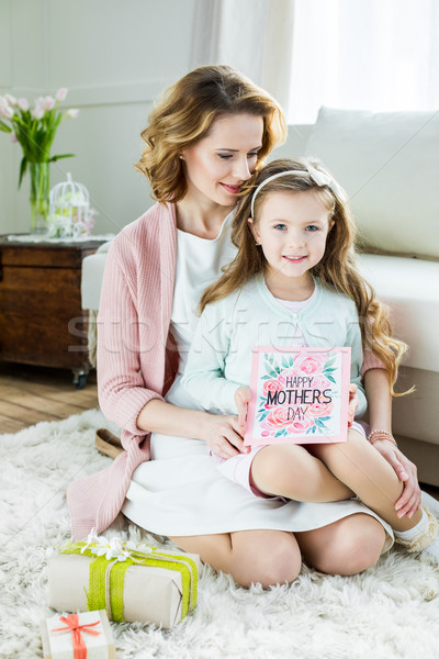 Smiling mother and daughter on Mothers Day Stock photo © LightFieldStudios