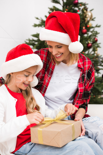 Stock photo: mother and daughter with christmas present