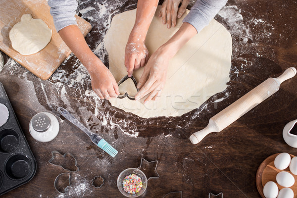 family cutting out cookie Stock photo © LightFieldStudios