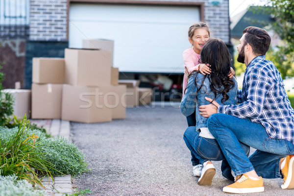 Happy girl rodziców ruchu domu Zdjęcia stock © LightFieldStudios