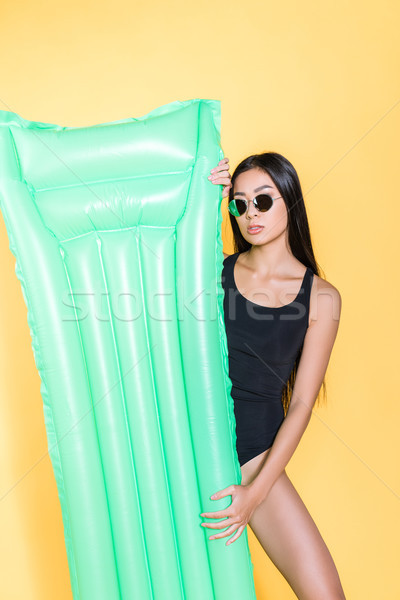woman in swimsuit with pool mattress Stock photo © LightFieldStudios