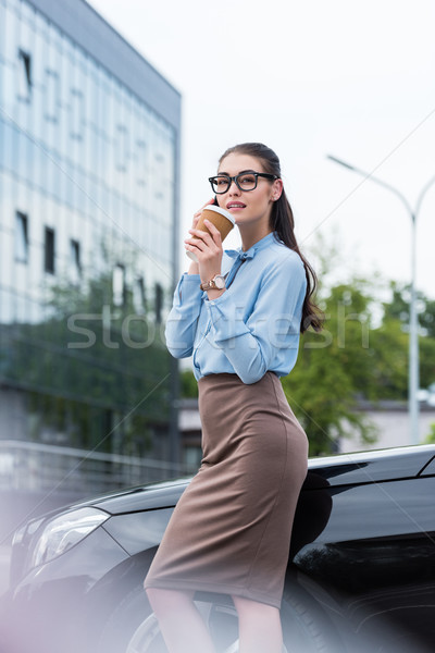 businesswoman talking on smartphone with coffee Stock photo © LightFieldStudios