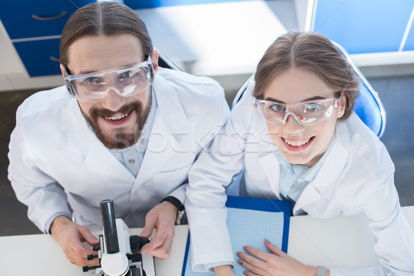 Travail microscope professionnels souriant caméra science Photo stock © LightFieldStudios