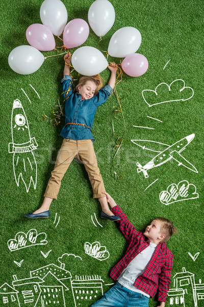 Menina voador ar balões menino Foto stock © LightFieldStudios