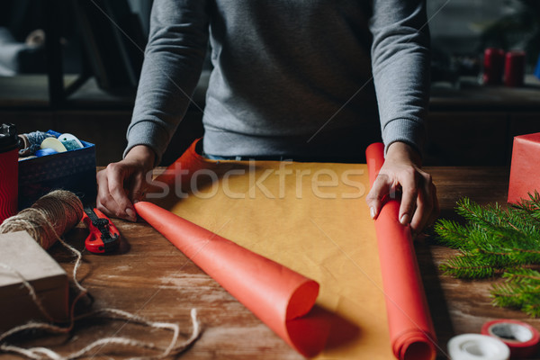 woman decorating christmas gift Stock photo © LightFieldStudios