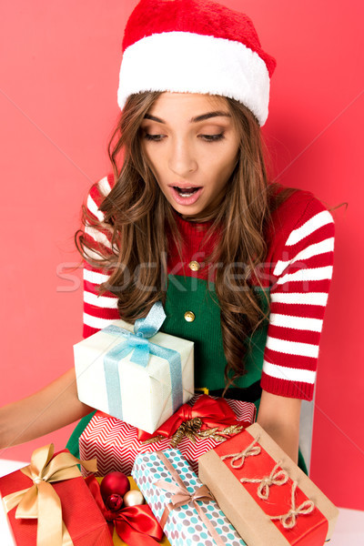 woman in elf costume with presents Stock photo © LightFieldStudios