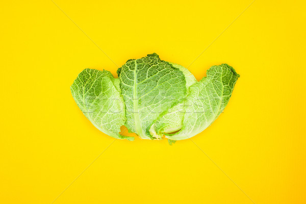 top view of fresh healthy savoy cabbage isolated on yellow Stock photo © LightFieldStudios