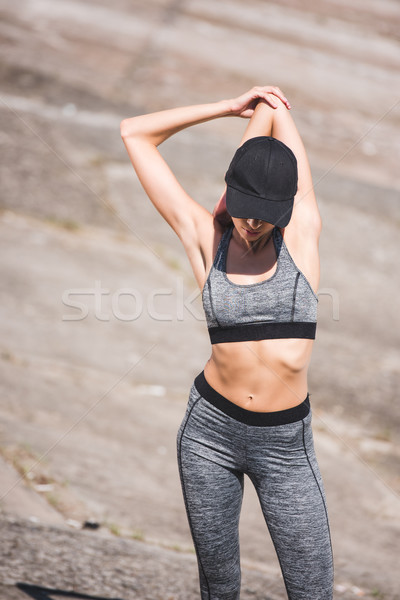 woman stretching on slabs Stock photo © LightFieldStudios