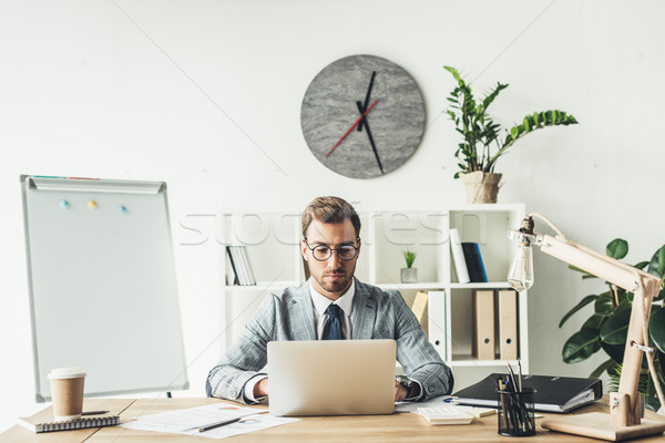 businessman working with laptop Stock photo © LightFieldStudios