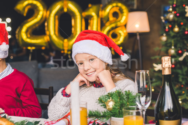 девушки сидят Рождества таблице мало счастливая девушка Сток-фото © LightFieldStudios