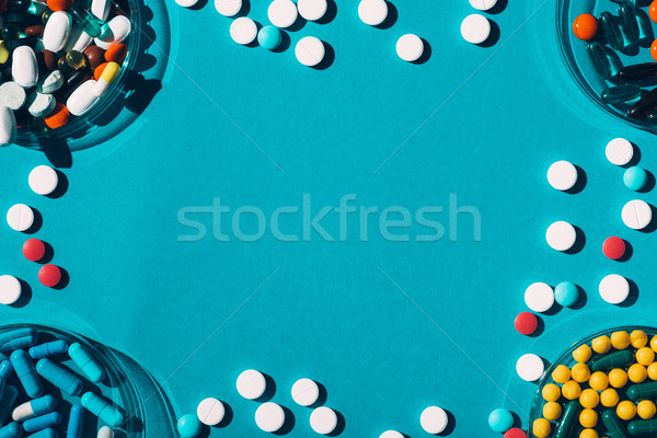 Stock photo: colorful pills in petri dishes