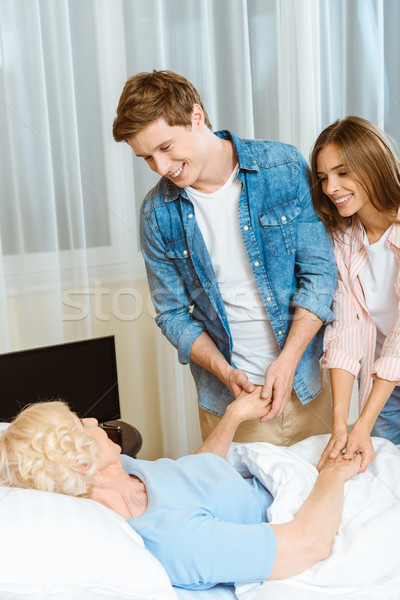 Couple visiting sick senior woman Stock photo © LightFieldStudios