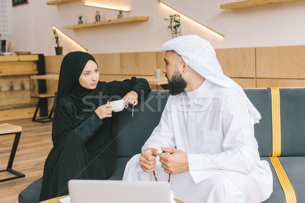 muslim couple spending time in cafe Stock photo © LightFieldStudios