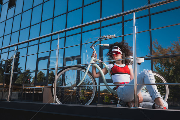 stylish woman with bicycle Stock photo © LightFieldStudios