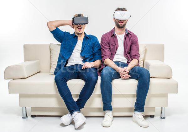 Friends in virtual reality headsets Stock photo © LightFieldStudios