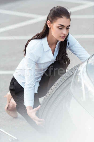Nő autó autógumi fiatal vonzó nő hivatalos Stock fotó © LightFieldStudios