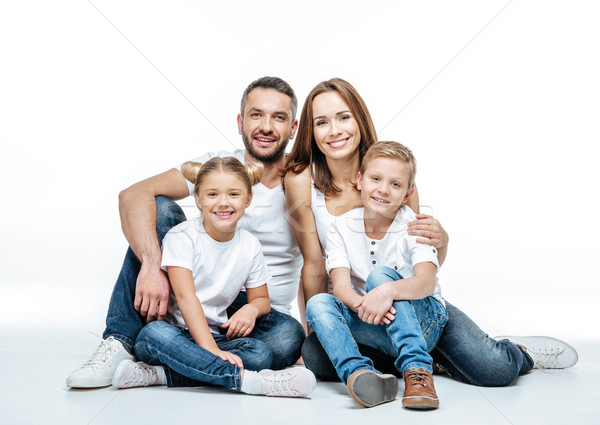 Happy family sitting together Stock photo © LightFieldStudios