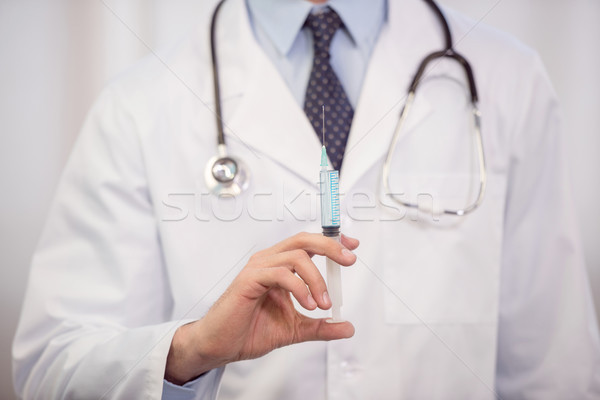 Médico jeringa vista doctor de sexo masculino medicina Foto stock © LightFieldStudios