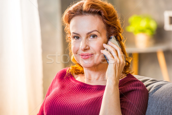 Woman talking on mobile phone Stock photo © LightFieldStudios