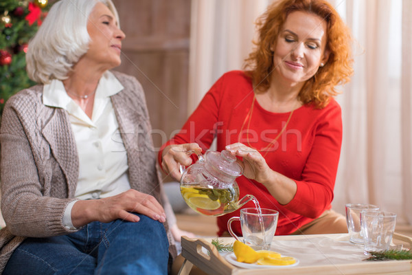 Stock photo: Woman pouring tea