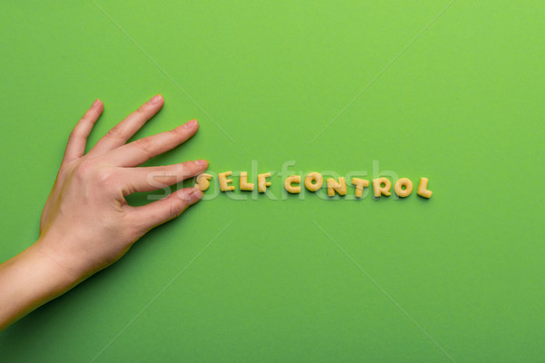 self controt concept,  person making words of cookies isolated on green. healthy lifestyle and healt Stock photo © LightFieldStudios