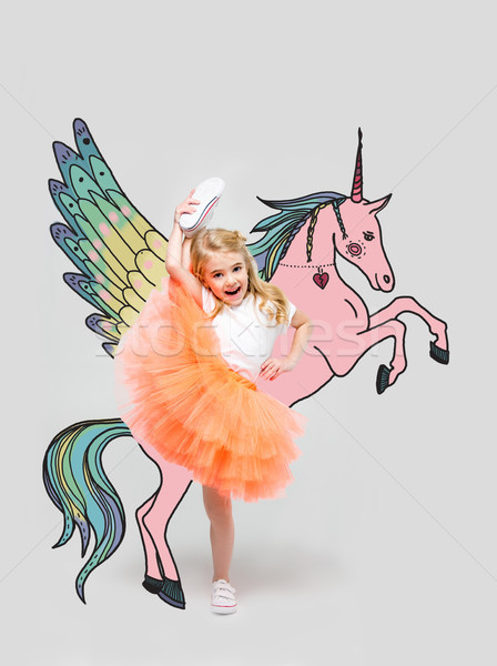 girl with hand drawn colorful unicorn Stock photo © LightFieldStudios