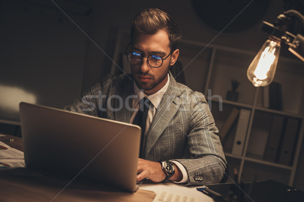 businessman working with laptop Stock photo © LightFieldStudios