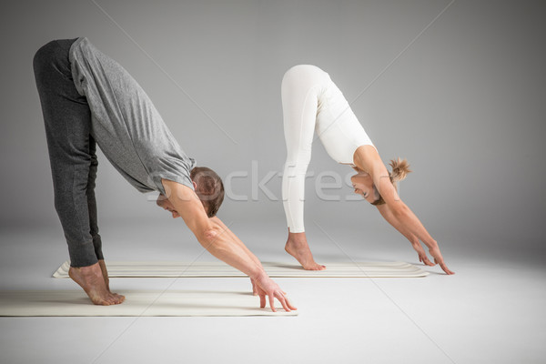 Couple practicing yoga Stock photo © LightFieldStudios