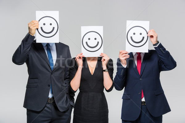 Stock photo: Businesspeople holding cards