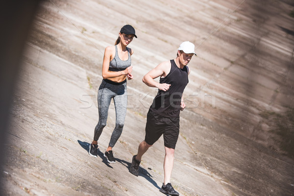 couple jogging on slabs Stock photo © LightFieldStudios