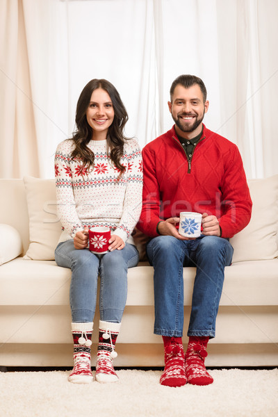Stock photo: couple with cups at christmastime