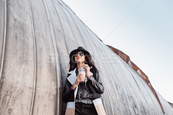  Woman in autumn outfit standing with milk shake Stock photo © LightFieldStudios