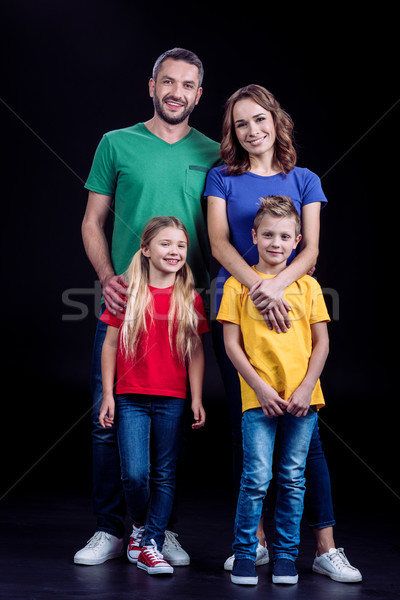 Family smiling at camera  Stock photo © LightFieldStudios