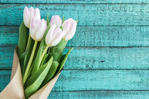 light pink tulips bouquet on turquoise wooden tabletop with copy space, wedding flowers background c Stock photo © LightFieldStudios