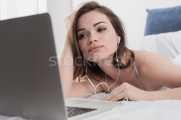 woman with laptop at home Stock photo © LightFieldStudios