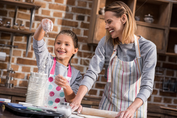 mother and daughter making cookies Stock photo © LightFieldStudios