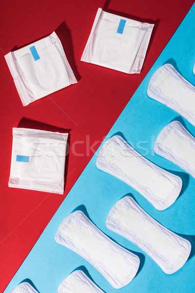 top view of pads and daily liners on red and blue Stock photo © LightFieldStudios